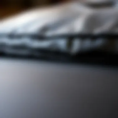 Close-up of the texture and stitching of a black leather ottoman