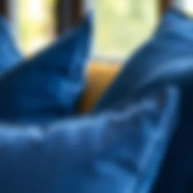 A close-up of the texture and fabric of oversized blue pillows