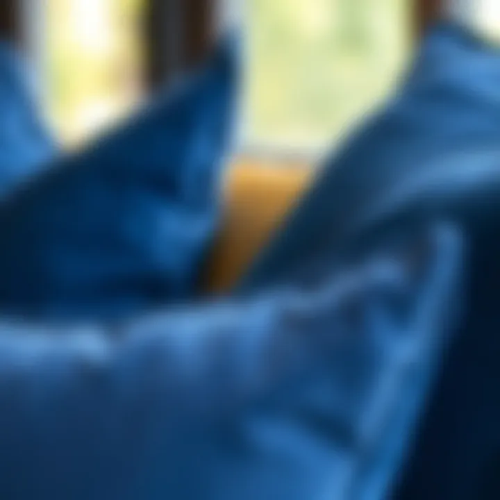 A close-up of the texture and fabric of oversized blue pillows