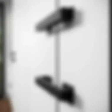 Sleek modern black drawer handles on a minimalist kitchen cabinet