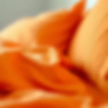Close-up of soft fabric texture in orange sheets